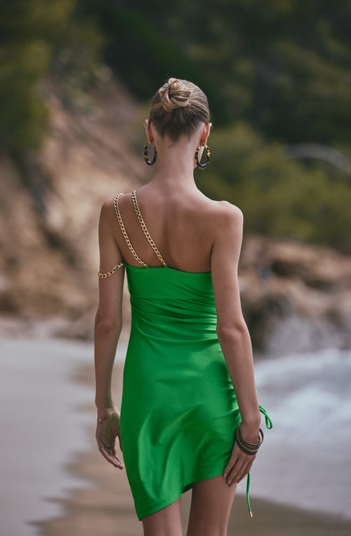 Draped green beach dress Ambre with asymmetrical neckline and gold jew - Marjolaine Draped green beach dress Ambre with asymmetrical neckline and gold jew - Marjolaine